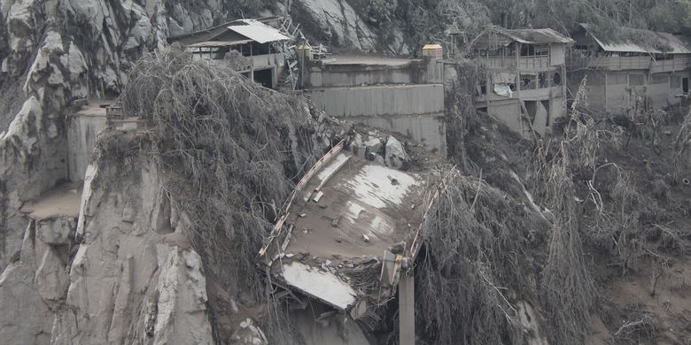 A bridge in Lumajang regency in East Java collapsed on Monday, December 6, 2021 following hot ash from Mount Semeru that first erupted three days before. The highest volcano on Java island erupted again on Monday, December 6, 2021.  