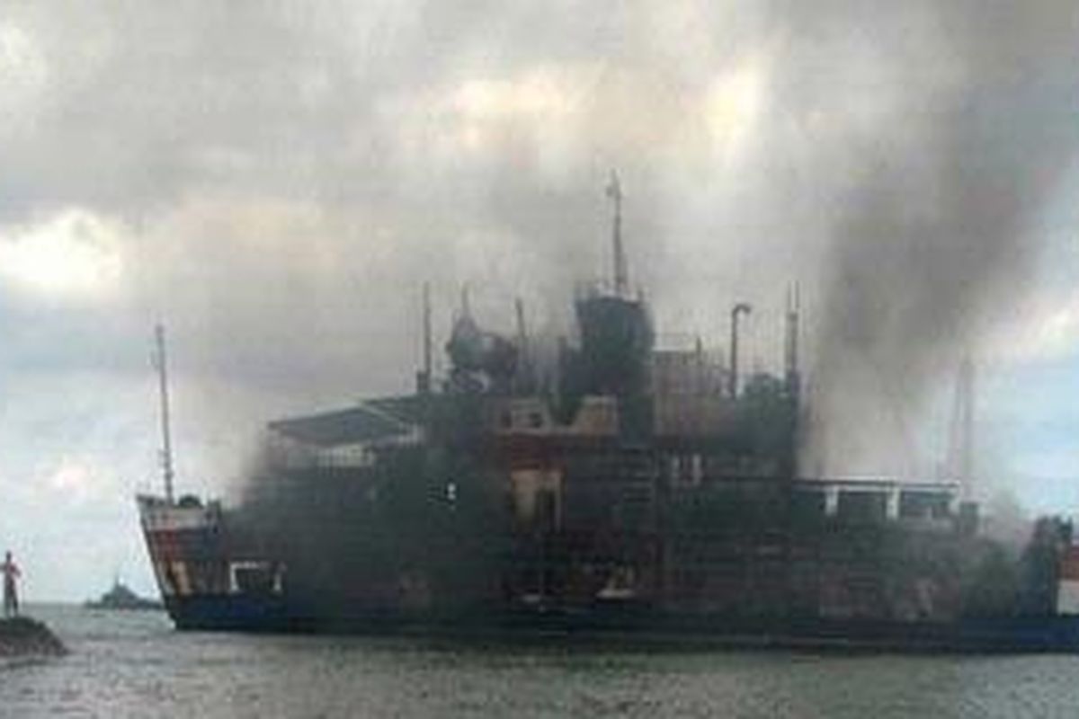 The damaged Indonesian Laut Teduh 2 ferry, which caught fire, is towed to Anyer beach in Indonesias Banten province January 28, 2011. At least eleven people were killed on Friday after a fire broke out on the ferry, which was heading to Sumatra island, according to a local television reporter. Around 200 passengers were onboard the ferry and about 100 have been rescued by passing vessels.