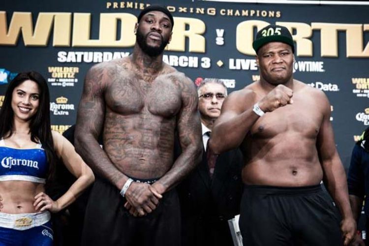 Deontay Wilder (kiri) dan Luis Ortiz (kanan)