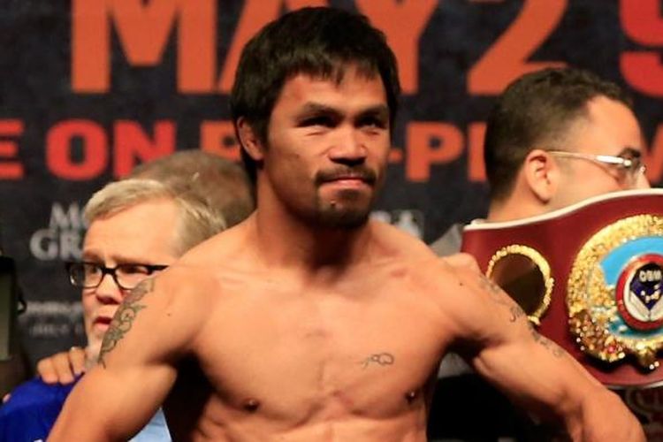 Petinju Filipina, Manny Pacquiao, berpose saat acara timbang badan di Las Vegas, Jumat (1/5/2015). Pacquiao akan menghadapi Floyd Mayweather Jr (Amerika Serikat) di MGM Grand Garden Arena, Las Vegas, Sabtu (2/5/2015).