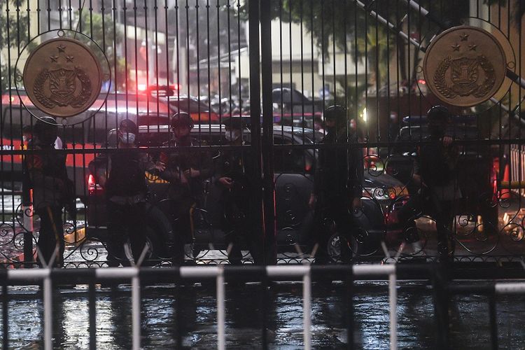 Police in bulletproof vests and assault rifles guard the Indonesian National Police Headquarters in Jakarta, hours after a woman carried out a lone wolf attack aimed at National Police Chief General Listyo Sigit Prabowo on Wednesday, March 31.