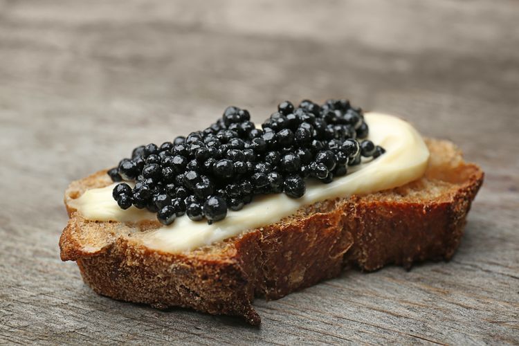 Ilustrasi sandwich dengan topping kaviar. 