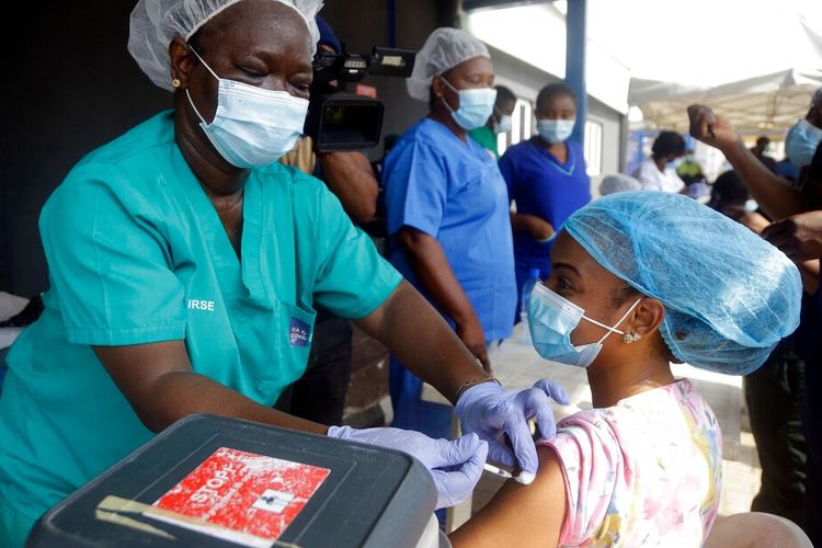 Hospital staff receives one of the country's first coronavirus vaccinations using Astra Zeneca vaccine manufactured by the Serum Institute of India and provided through the global COVAX initiative, at Yaba Mainland Hospital in Lagos, March 12, 2021