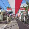 Warga Malang Bentangkan Bendera Merah Putih Sepanjang 308 Meter di Sepanjang Jalan