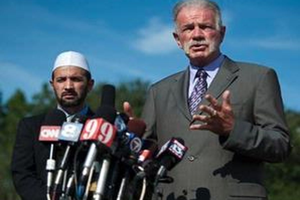 Pastor Terry Jones of the Dove World Outreach Center speaks to the media as Imam Muhammad Musri of the Islamic Society of Central Florida looks on at left, Thursday, Sept. 9, 2010, in Gainesville, Fla 