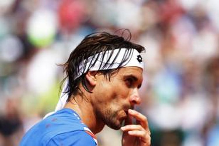 Petenis Spanyol David Ferrer bereaksi saat menghadapi Rafael Nadal yang juga berasal dari Spanyol pada perempat final Monte Carlo Masters, Jumat (18/4/2014). Ferrer menang 7-6 (1), 6-4.