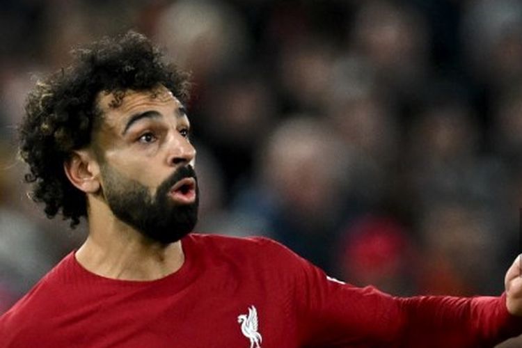 Striker asal Mesir, Mohamed Salah, saat beraksi membela Liverpool untuk melawan Real Madrid dalam leg pertama 16 besar Liga Champions 2022-2023 di Stadion Anfield pada 21 Februari 2023. Artikel ini berisi top skor Liga Champions. (Foto oleh Paul ELLIS / AFP)