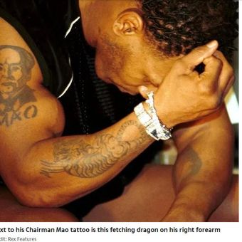 Tato naga yang ada di tangan kanan Mike Tyson