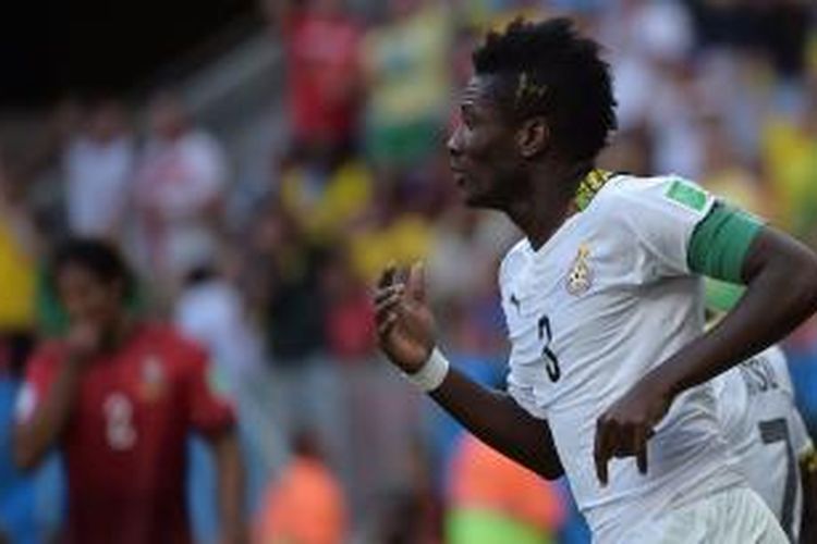 Penyerang sekaligus kapten timnas Ghana, Asamoah Gyan, merayakan gol yang dicetaknya ke gawang Portugal pada laga penyisihan Grup G Piala Dunia 2014, Kamis (26/6/2014).