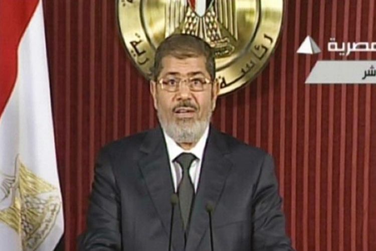 Presiden Mesir, Mohammed Morsi saat menyampaikan pidato di televisi pemerintah.