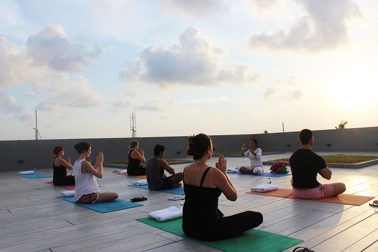 A file photo of yogis during sunset yoga in TS Suites Seminyak, Bali. 