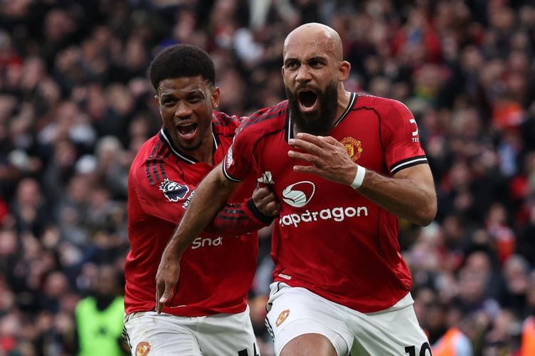 Momen selebrasi gol Bryan Mbeumo (kanan) bersama Amad Diallo (Kir) dalam pertandingan sepak bola Liga Inggris antara Manchester United vs Manchester City di Old Trafford di Manchester, barat laut Inggris, pada 17 Januari 2026. (Foto oleh Darren Staples / AFP) 