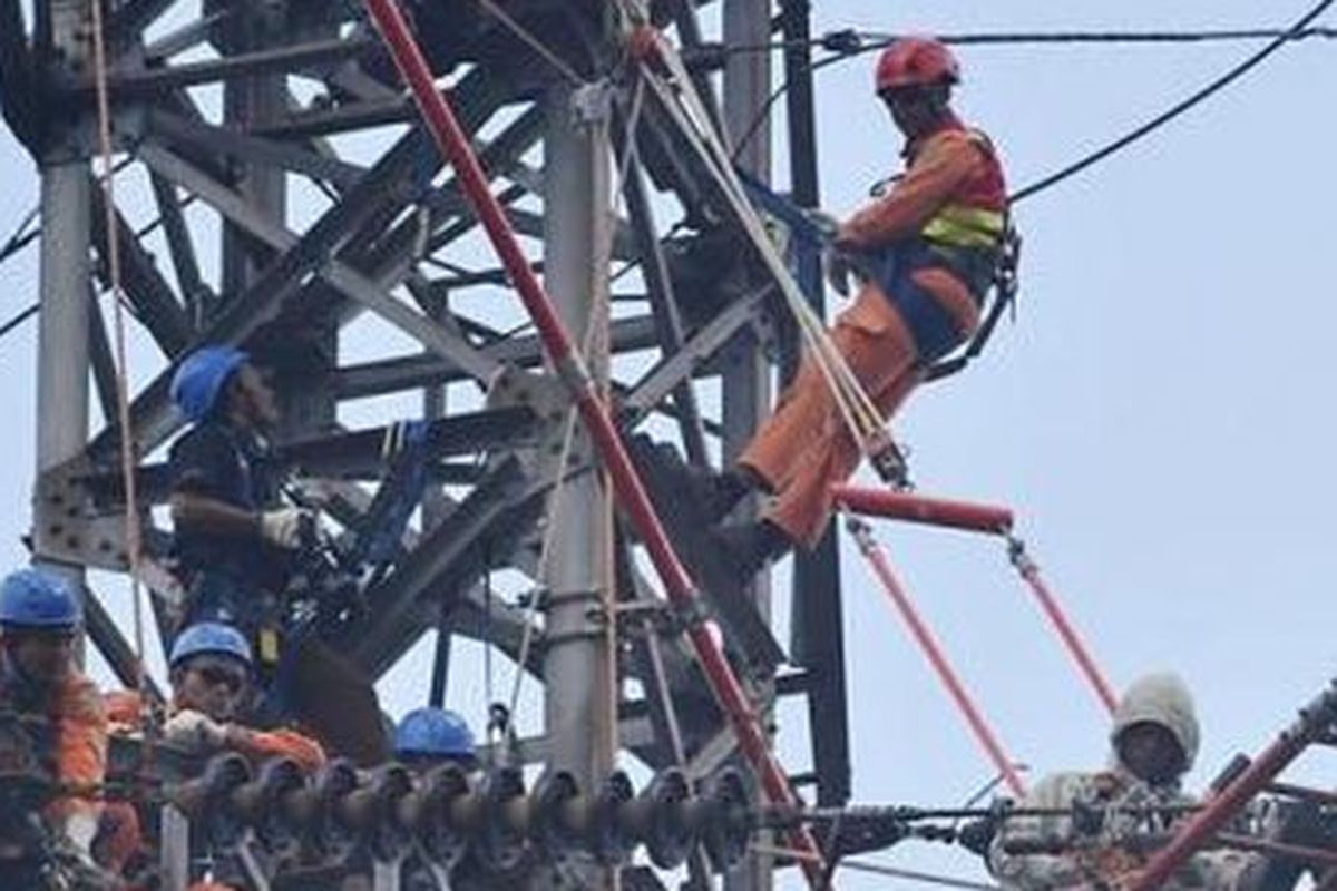 An illustration of employees of state electricity utility Perusahaan Listrik Negara (PLN).  