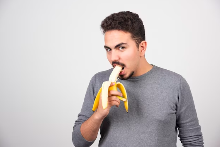 Ilustrasi pria makan pisang