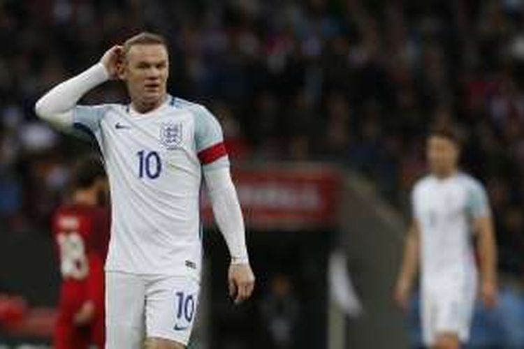 Penyerang Inggris, Wayne Rooney, tampil pada laga persahabatan kontra Portugal di Stadion Wembley, London, pada 2 Juni 2016.