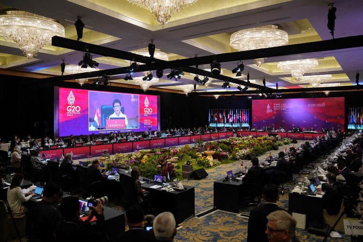 Indonesia's Foreign Minister Retno Marsudi (on screen) speaks during a meeting at the G20 Foreign Ministers' Meeting in Nusa Dua on the Indonesian resort island of Bali on July 8, 2022. (Photo by DITA ALANGKARA / POOL / AFP)