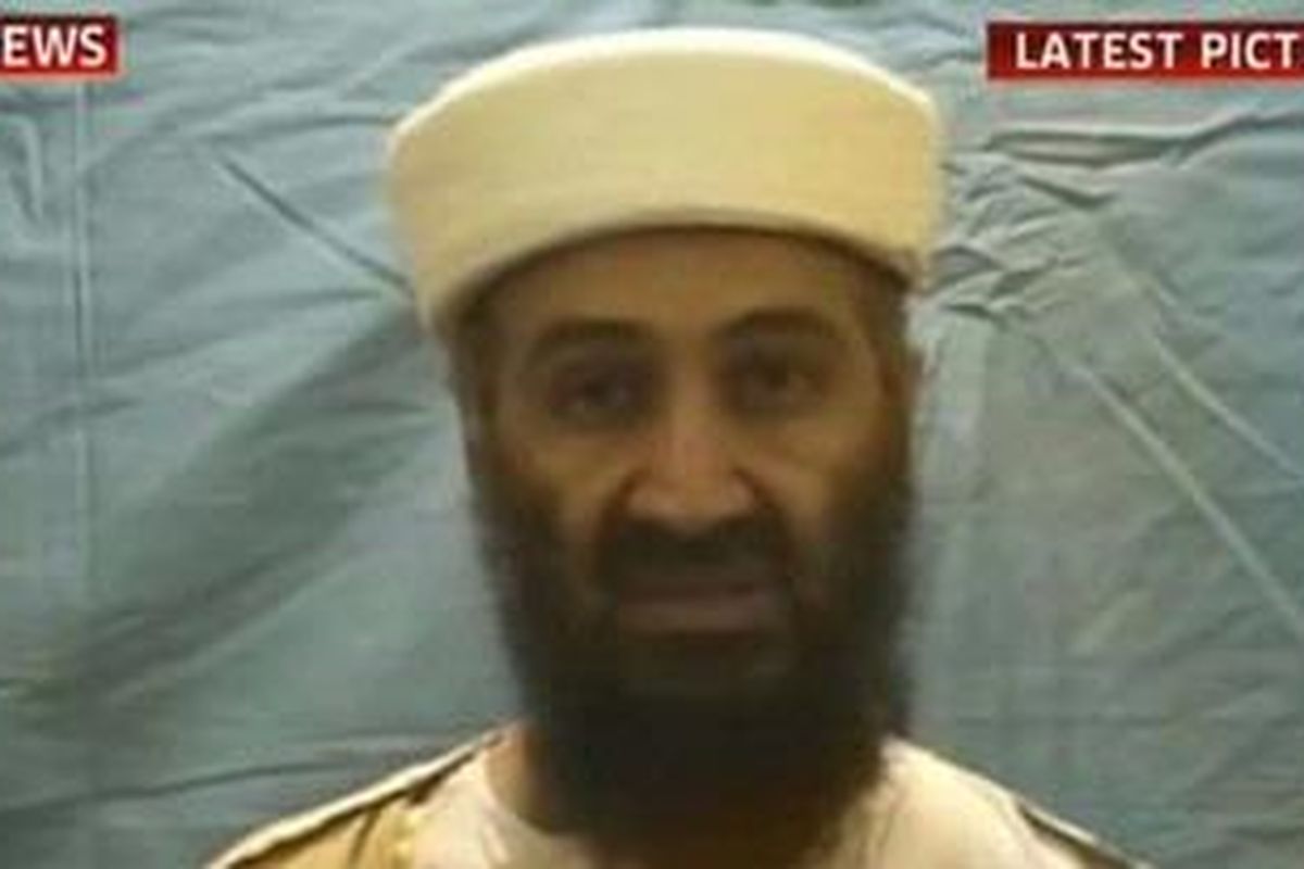 Video Five: In the fifth video released by the White House, Bin Laden is back in his gold robes but the backdrop is now a less impressive un-ironed white sheet  