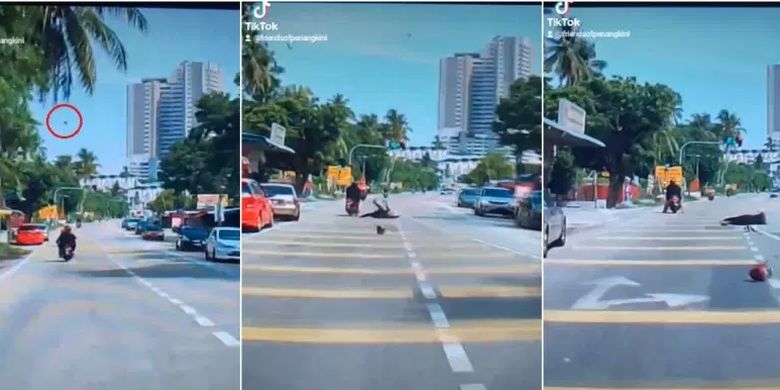 Tangkapan layar dari video buah kelapa jatuh menimpa kepala pengendara motor di Teluk Kumbar, Penang, Malaysia.