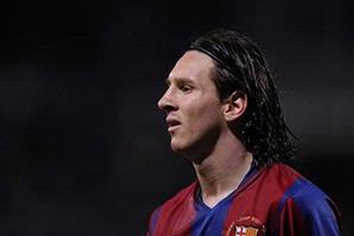 Striker Barcelona, Lionel Messi, merasa bahagia di Barcelona.