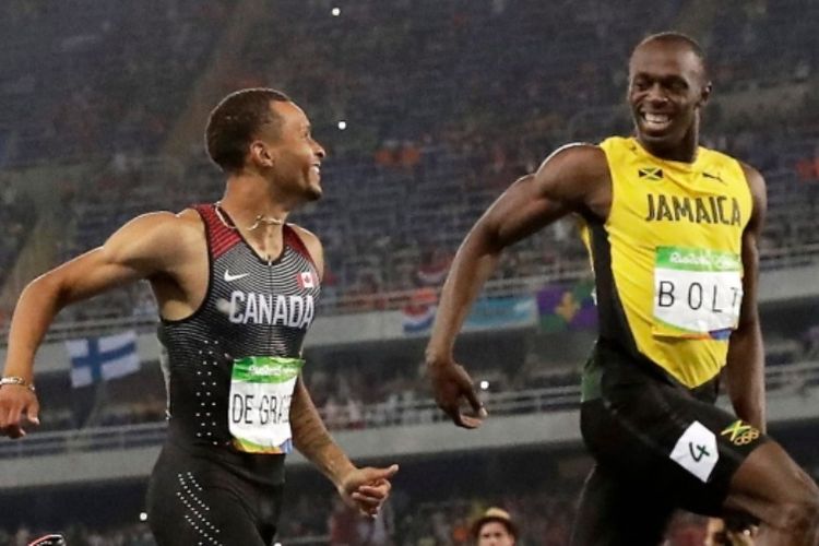 Usain Bolt (kanan) dan Andre de Grasse (kiri)