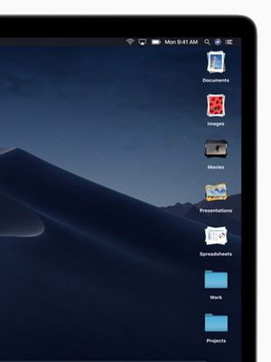 Fitur Stacks merapikan tampilan desktop MacOS Mojave dengan mengelompokkan aneka item berdasarkan jenisnya. 