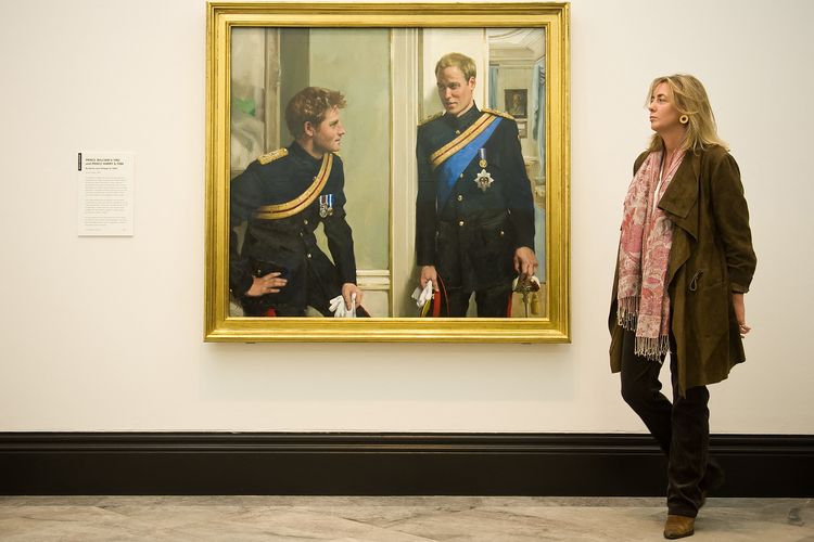 Artist Nicky Philipps stands with her work, Prince William and Prince Harry: a new portrait by Nicky Philipps at the National Portrait gallery in central London, on January 6, 2010. The painting is the first double portrait of the royal brothers and was commissioned by the gallery. AFP PHOTO/Leon Neal (Photo by LEON NEAL / AFP)