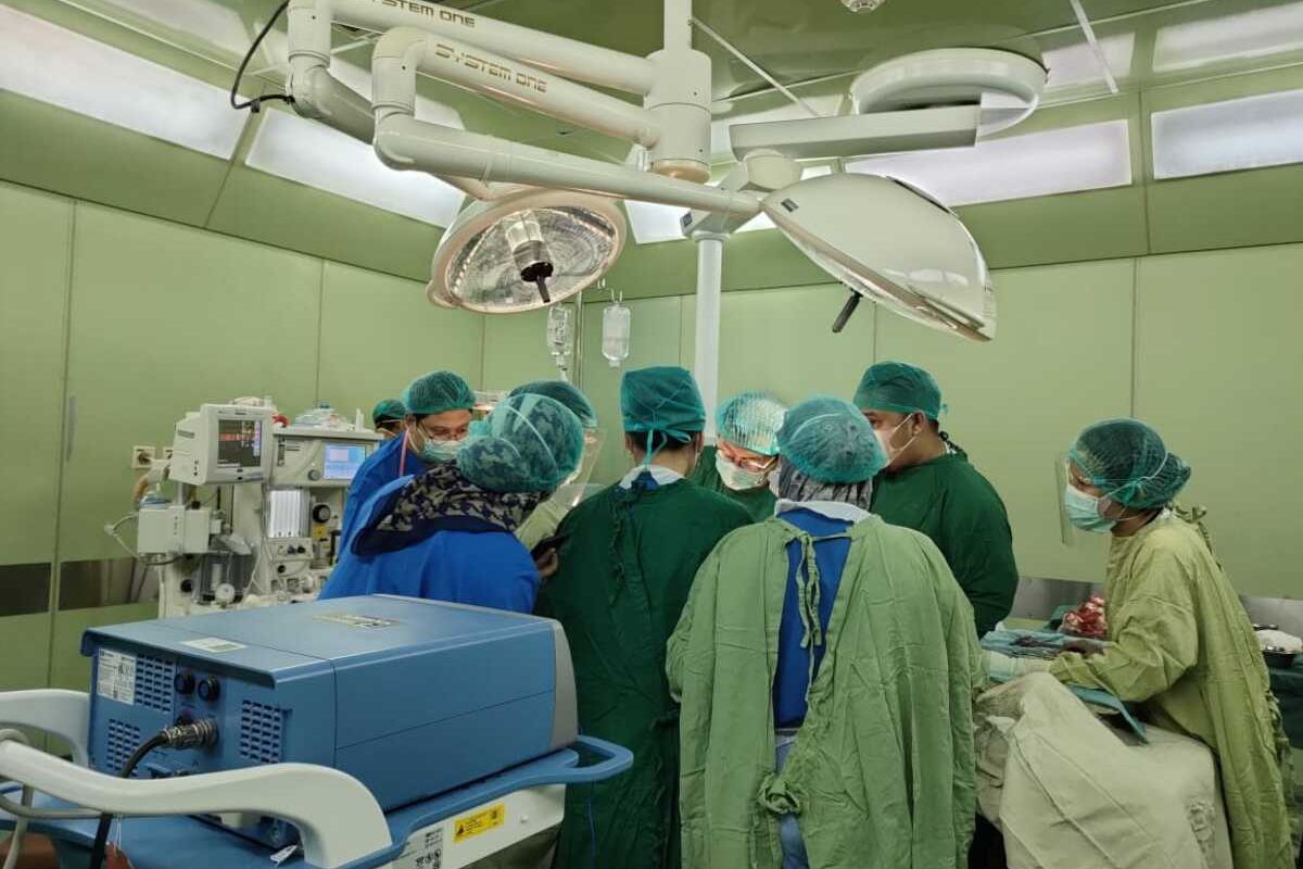 A team of doctors perform a cesarean section operation on a patient who gives birth to a two-headed baby at the Mohammad Hoesin Central General Hospital (RSUP) in Palembang on Friday, Jan.14, 2022.