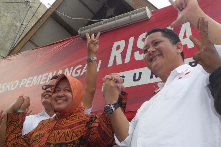 Pasangan calon Wali Kota dan Wakil Wali Kota Surabaya Tri Rismaharini dan Whisnu Sakti Buana mendatangi posko pemenangan di Jalan Kapuas 68, Surabaya, Rabu (9/12/2015).