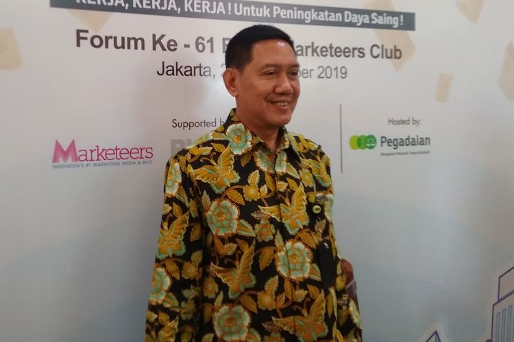 Direktur Utama Pegadaian Kuswiyoto berpose usai menjelaskan kinerja perusahaan di Jakarta, Senin (23/9/2019).