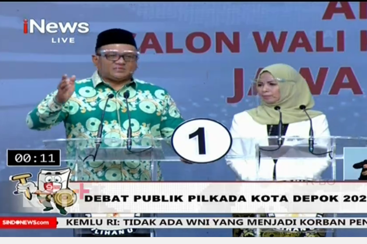 Paslon wali kota dan wakil wali kota Depok nomor urut 1, Pradi-Afifah, dalam debat publik Pilkada Depok yang ditayangkan di INews TV, Minggu (22/11/2020). 