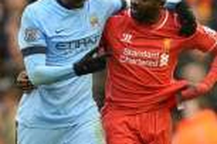 Yaya dan Kolo Toure berbincang seusai pertandingan antara Manchester City dan Liverpool, Maret 2015.