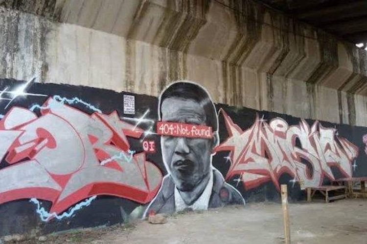 Mural yang diduga gambar wajah Presiden Joko Widodo (Jokowi) di sebuah dinding di kawasan Batujaya, Batuceper, Kota Tangerang.