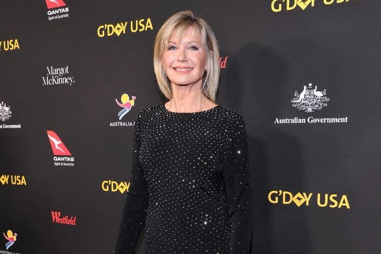 Aktris dan penyanyi Olivia Newton John menghadiri 2018 G'Day USA Black Tie Gala at InterContinental Los Angeles Downtown, Los Angeles, pada 27 Januari 2018. Olivia Newton-John meninggal dunia pada Senin, 8 Agustus 2022, di usia 73 tahun.