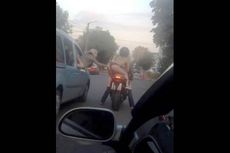 Wanita Tanpa Kutang Naik Sepeda Motor Melintasi Jalan Ramai