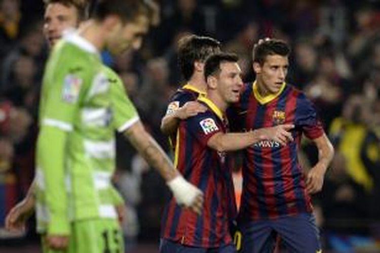 Striker Barcelona, Lionel Messi, saat merayakan golnya ke gawang Getafe pada leg pertama 16 besar Copa del Rey di Stadion Camp Nou, Rabu atau Kamis (9/1/2014) dini hari WIB. Barcelona menang 4-0 pada pertandingan tersebut. 