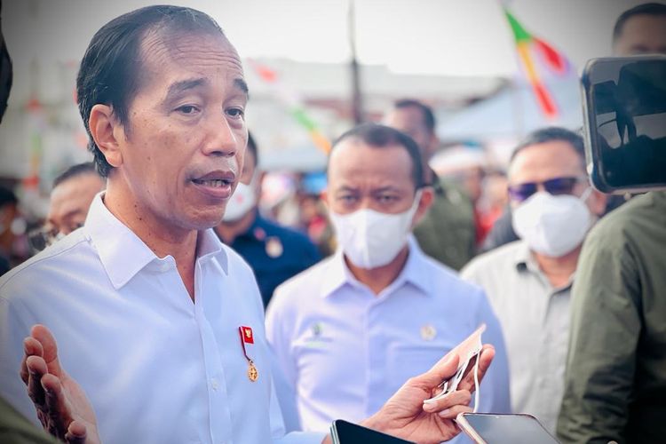 Indonesia's President Joko Widodo speaks to journalists on the sidelines of the distribution of social assistance program at the Olilit Market on Tanimbar island in the Maluku province Friday, Sept. 2, 2022. 