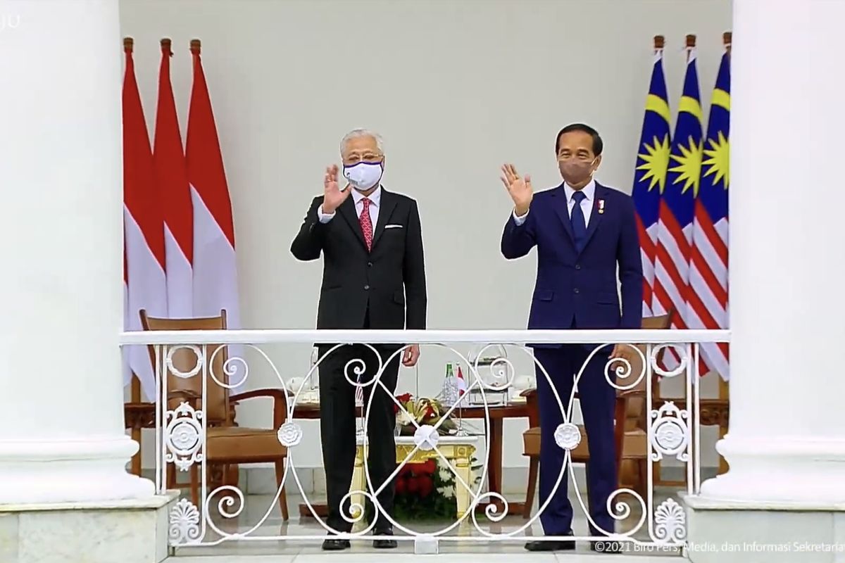 A screen grab from the Presidential Secretariat's official YouTube channel showing Indonesia's President Joko Widodo (right) and Malaysia's Prime Minister Ismail Sabri Yaakob during the latter's state visit to Bogor Palace on the outskirts of Jakarta dated November 10, 2021.  