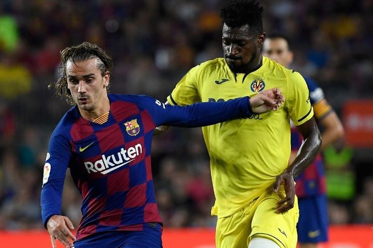 Antoine Griezmann dikawal Andre Frank Zambo pada laga Barcelona vs Villarreal dalam lanjutan La Liga Spanyol di Stadion Camp Nou, 23 September 2019. 