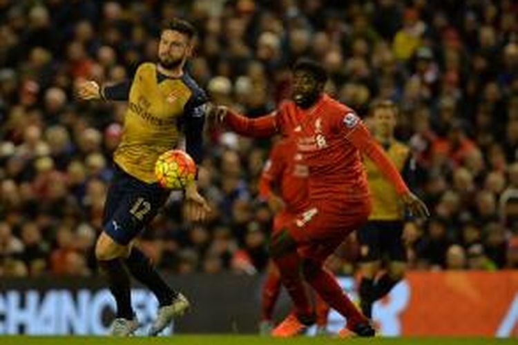 Penyerang Arsenal, Olivier Giroud, mencetak dua gol kala timnya bertandang ke markas Liverpool di Stadion Anfield, Rabu (13/1/2016) waktu setempat.