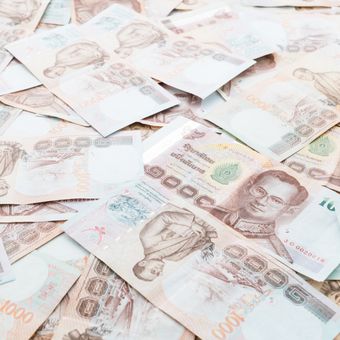 Ilustrasi uang baht Thailand.