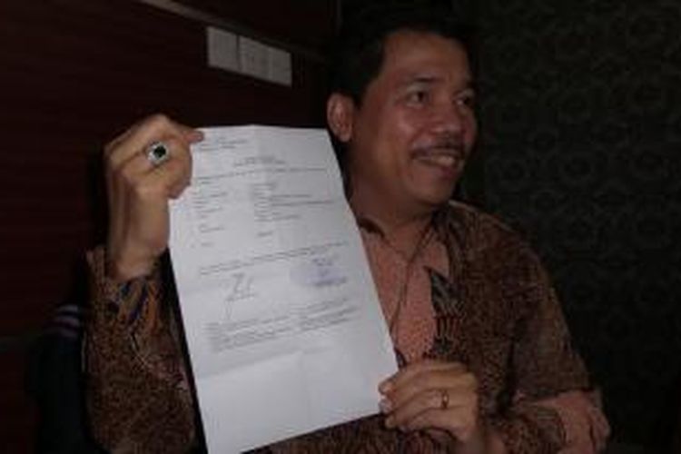 Ketua tim kuasa hukum Ilham Arief Sirajuddin, Johnson Panjaitan di Bareskrim Polri, Senin (15/6/2015).
