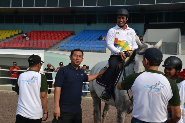 Menteri Pertanian Andi Amran Sulaiman saat melakukan kunjungan kerja ke Jakarta Equistrian Park (JEP) di Pulomas, Sabtu (14/7/2018).