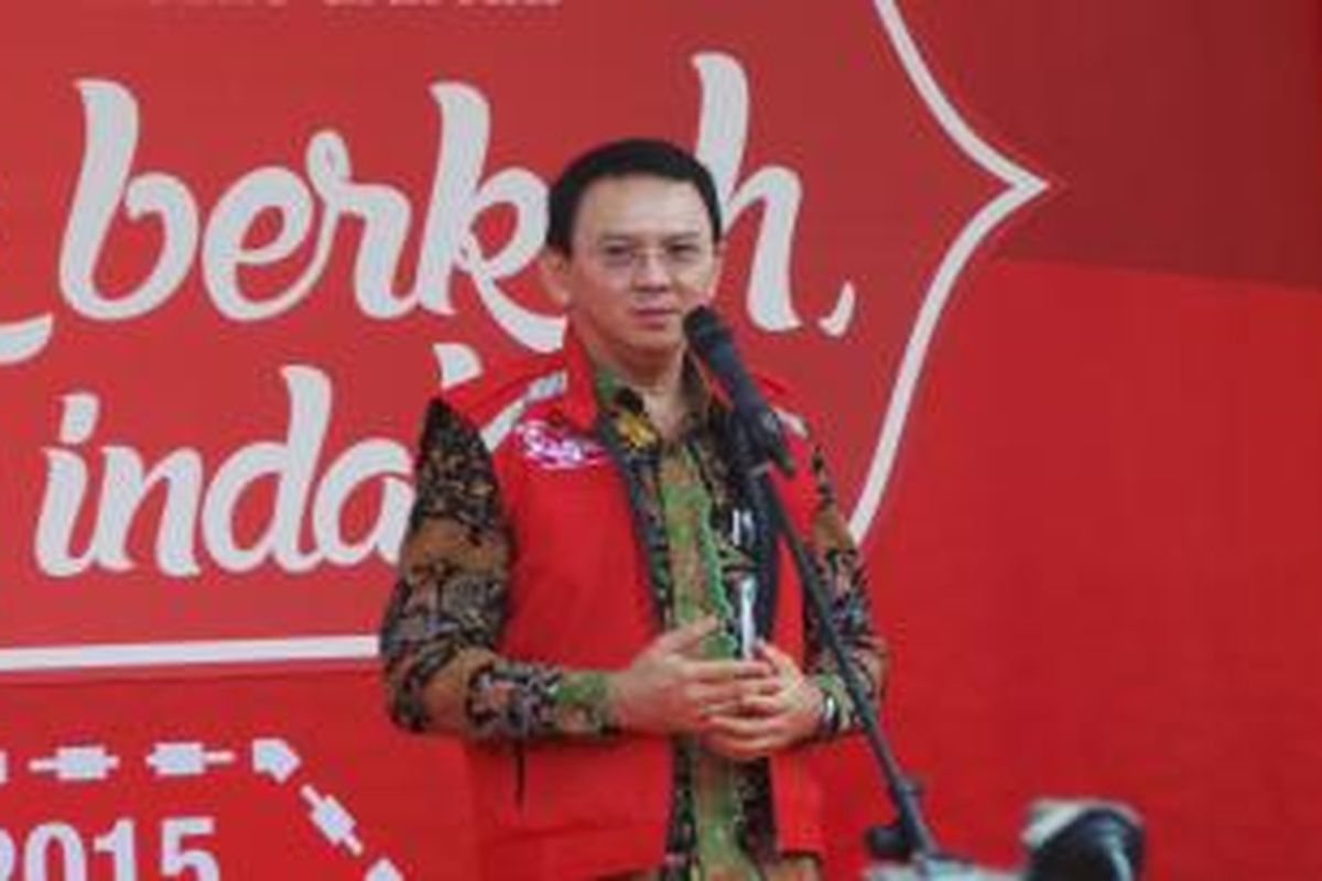 Gubernur DKI Jakarta Basuki Tjahaja Purnama melepas mudik bareng Telkomsel, di Parkir Timur Senayan, Selasa (14/7/2015). 