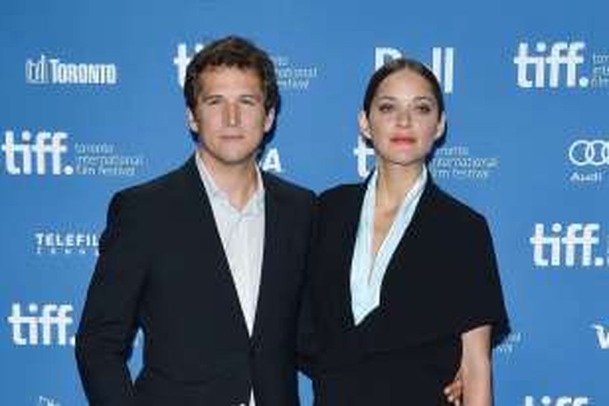 Marion Cotillard dan Guillaume Canet ketika menghadiri Toronto International Film Festival di Toronto, Kanada, pada 2013.