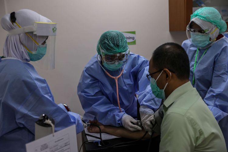 A file photo of a health care worker receives the China's Sinovac vaccine during the Covid-19 jab drive in RSIA Tambak in Central Jakarta on January 15. 