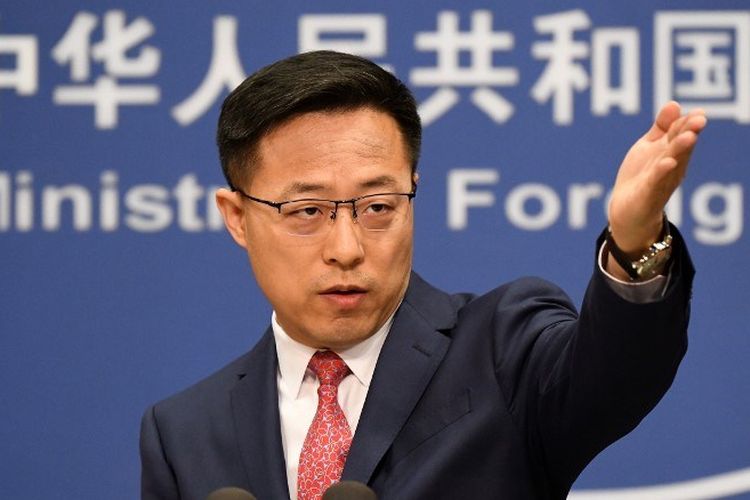 Chinese Foreign Ministry spokesman Zhao Lijian takes a question at the daily media briefing in Beijing on April 8, 2020. (Photo by GREG BAKER / AFP)