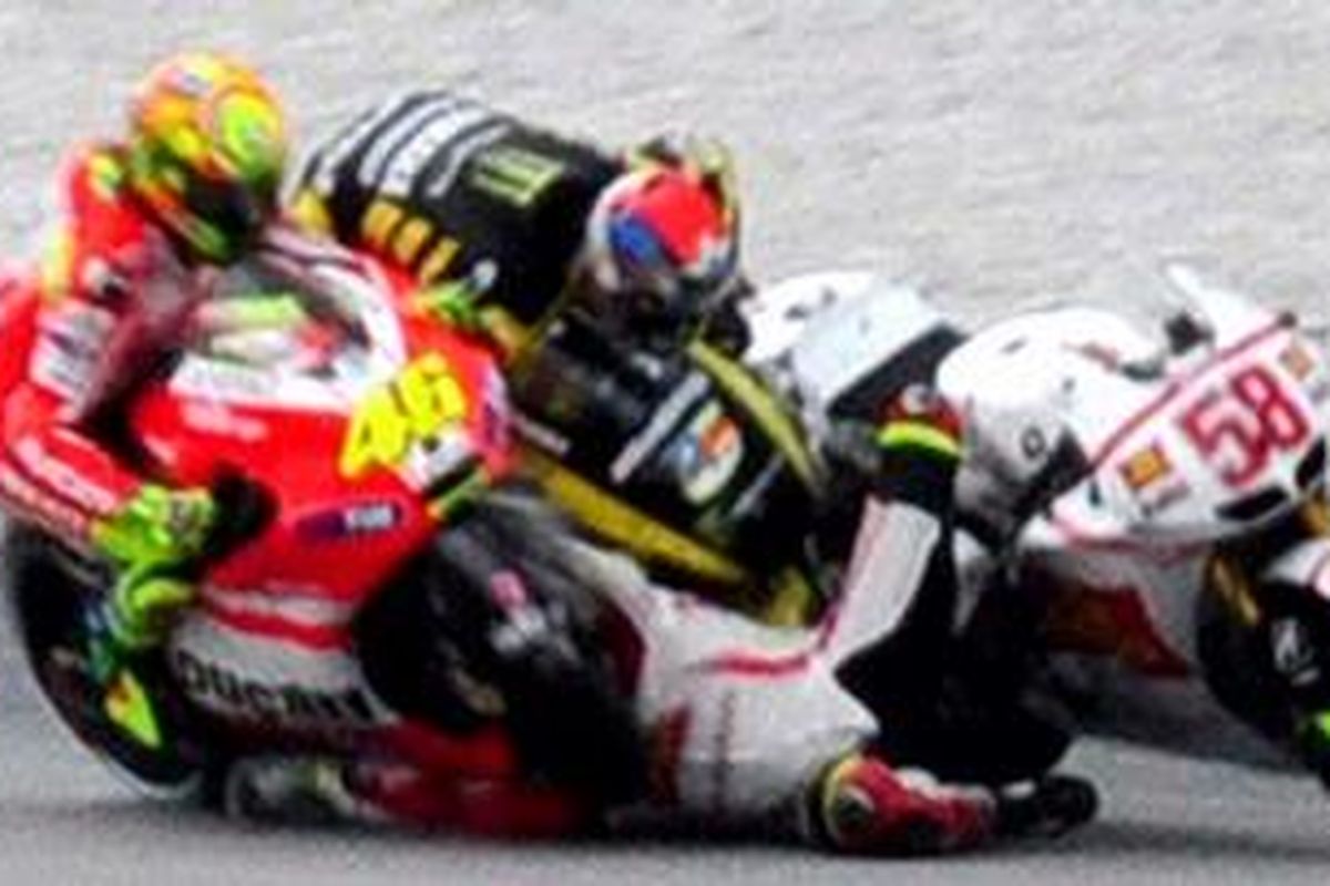 Deadly: The rider (No 58) is seen sliding from his bike and colliding with two other riders in a horrifying crash  