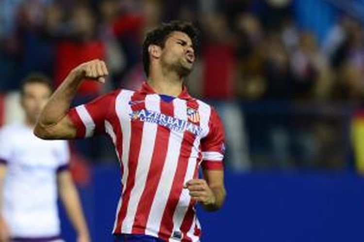 Striker Atletico Madrid Diego da Silva Costa merayakan gol keempat timnya yang dia cetak ke gawang Austria Vienna pada penyisihan grup Liga Champions, Rabu (6/11/2013).