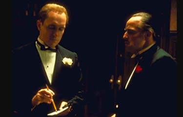 Tom Hagen, seorang consigliere bagi bos mafia Don Vito Corleone