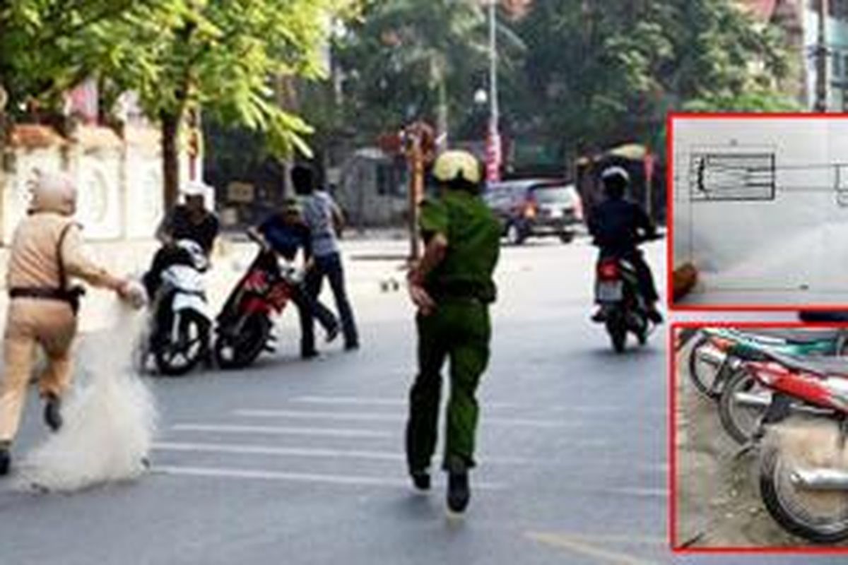 Polisi Vietnam menggunakan jala untuk menangkap pebalap liar.